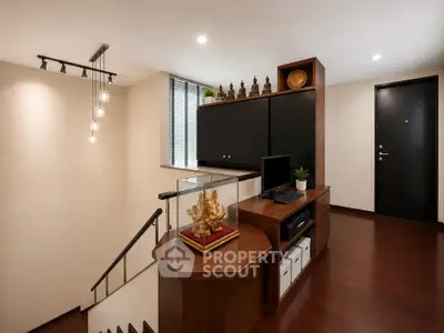 Elegant interior with wooden flooring and modern decor in a stylish home office space.