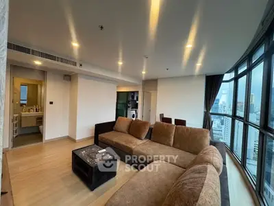 Spacious living room with panoramic city view and modern furnishings