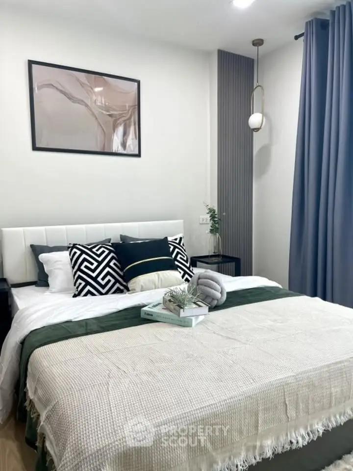 Modern bedroom with stylish decor and cozy bedding