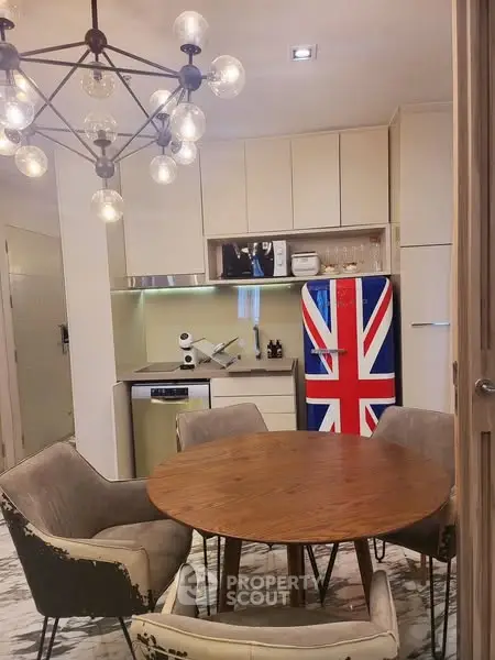 Stylish kitchen with Union Jack fridge and modern dining set