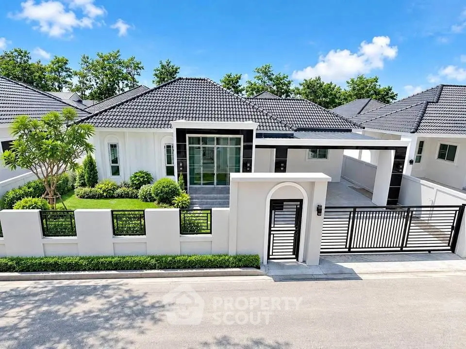 Modern single-story house with sleek design and spacious driveway in a serene neighborhood.