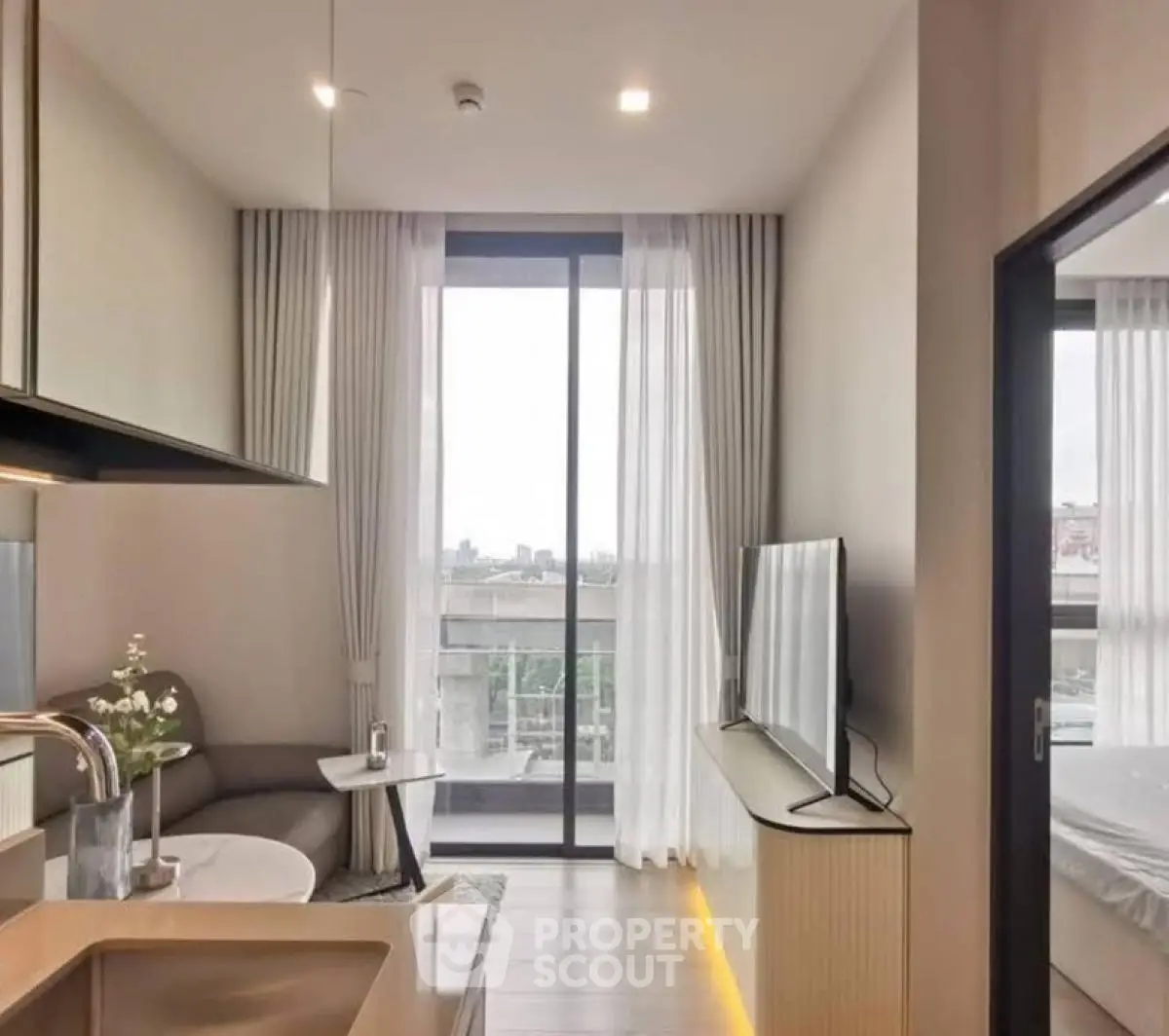 Modern apartment interior with open layout and large windows