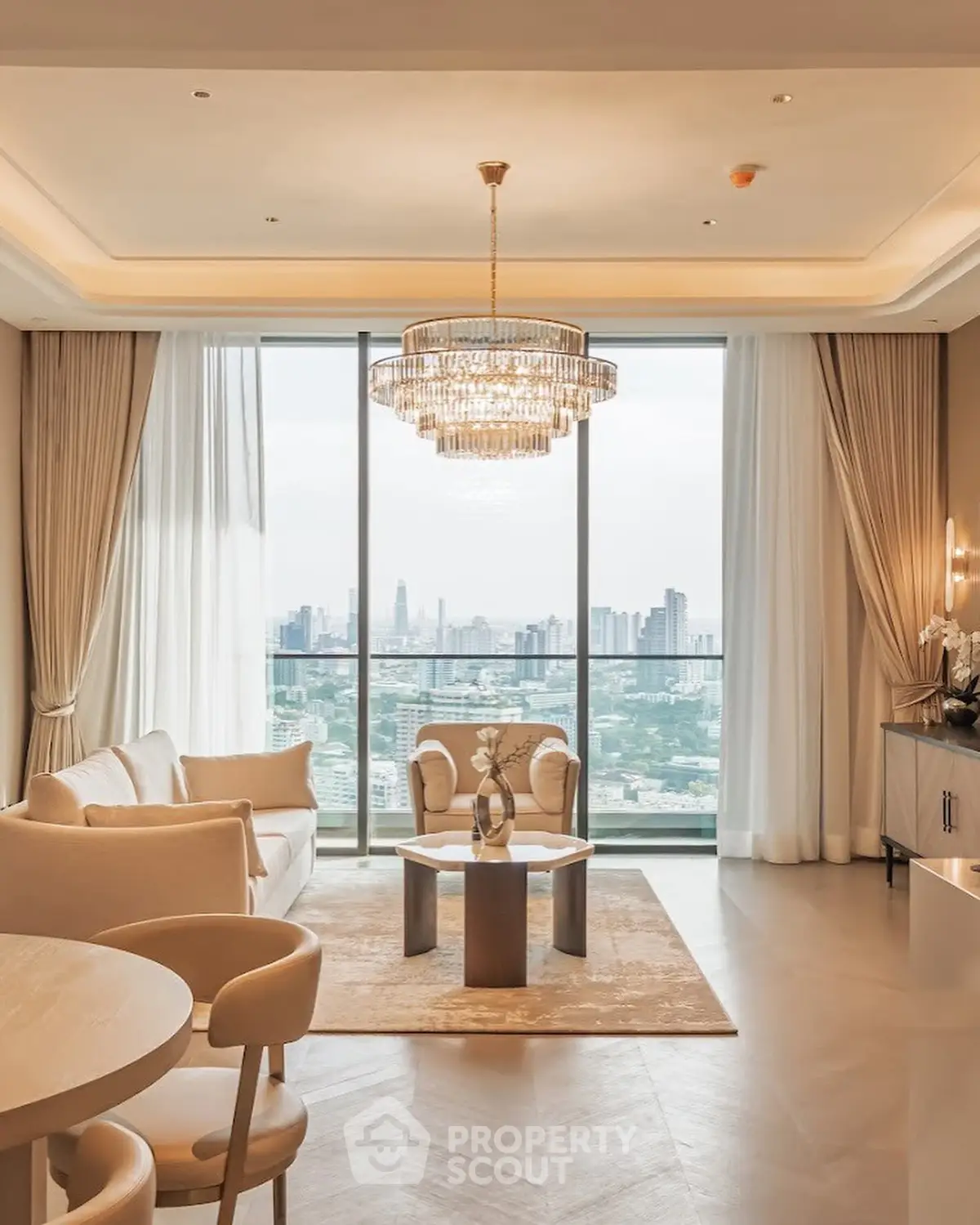 Luxurious living room with stunning city view and elegant chandelier