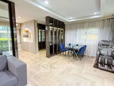 Spacious modern living room with elegant dining area and massage chair