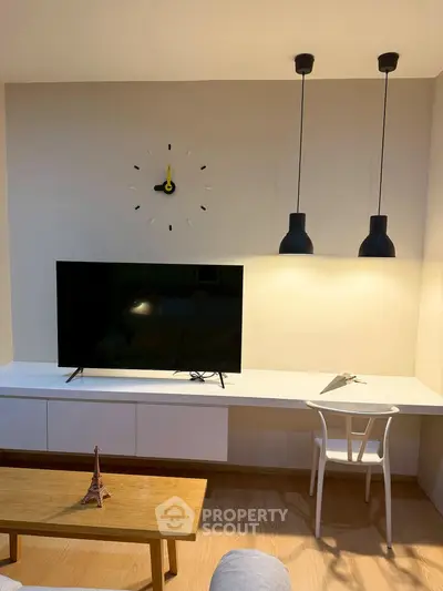 Modern living room with sleek TV setup and stylish lighting