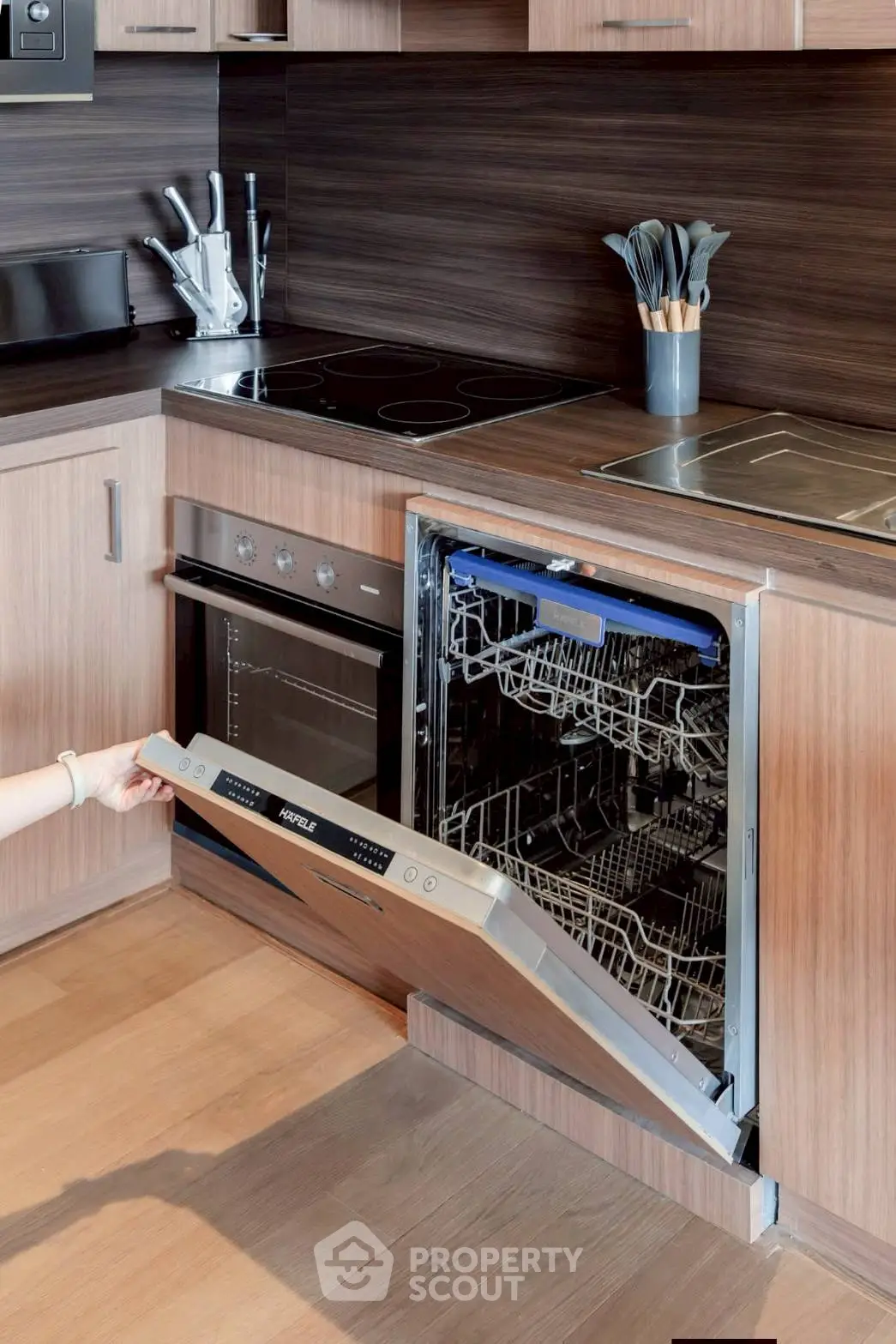 Modern kitchen with built-in dishwasher and sleek wooden cabinetry