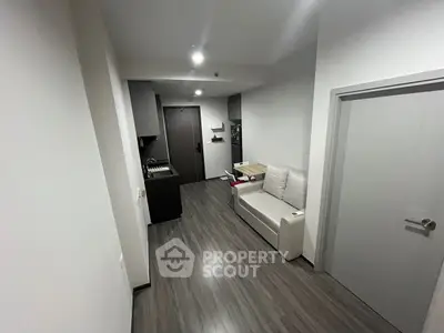 Modern apartment interior with sleek flooring and compact layout