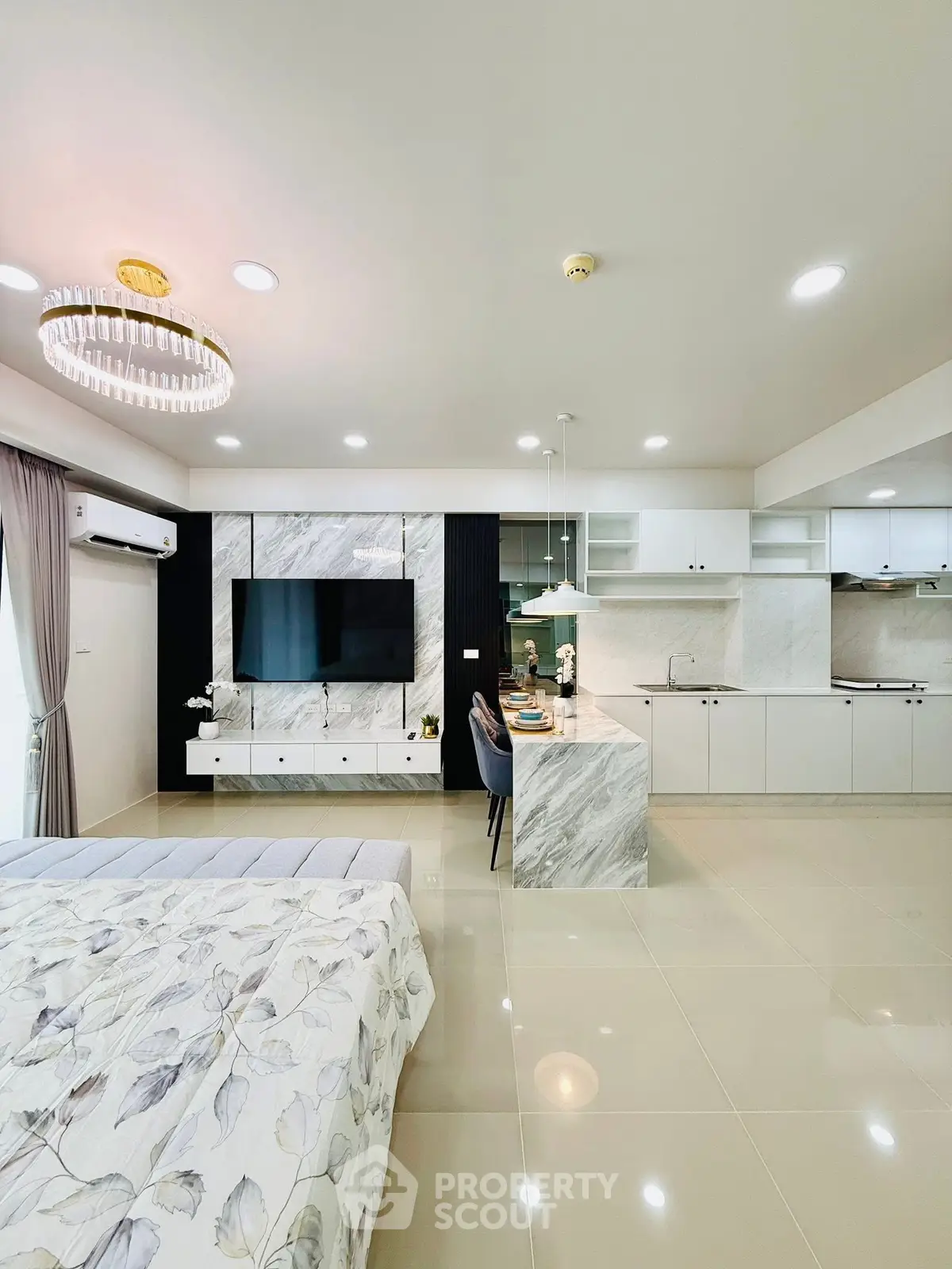 Modern open-plan living room with sleek kitchen and elegant decor