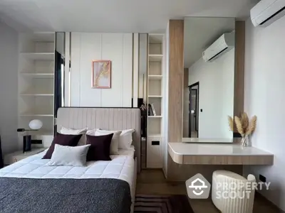 Modern bedroom with stylish decor, built-in shelves, and air conditioning unit