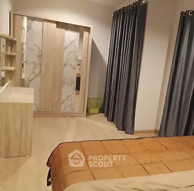 Modern bedroom with stylish wardrobe and cozy bedding