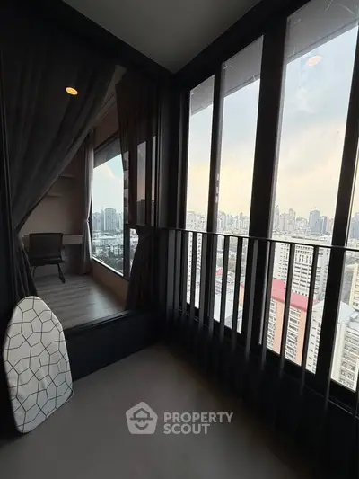 Stunning high-rise balcony with panoramic city views and sleek modern design.
