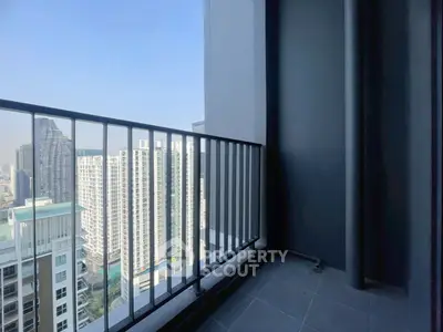 Modern high-rise balcony with stunning cityscape view, perfect for urban living enthusiasts.