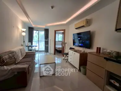 Modern living room with sleek furniture and large window view