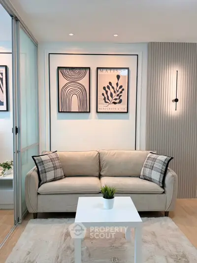 Modern living room with stylish decor and cozy beige sofa