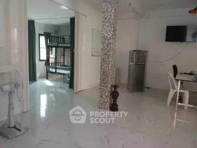 Spacious modern interior with marble flooring and bunk beds, ideal for shared living.
