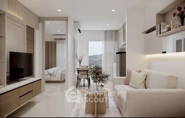 Modern open-plan living room with elegant decor and natural light