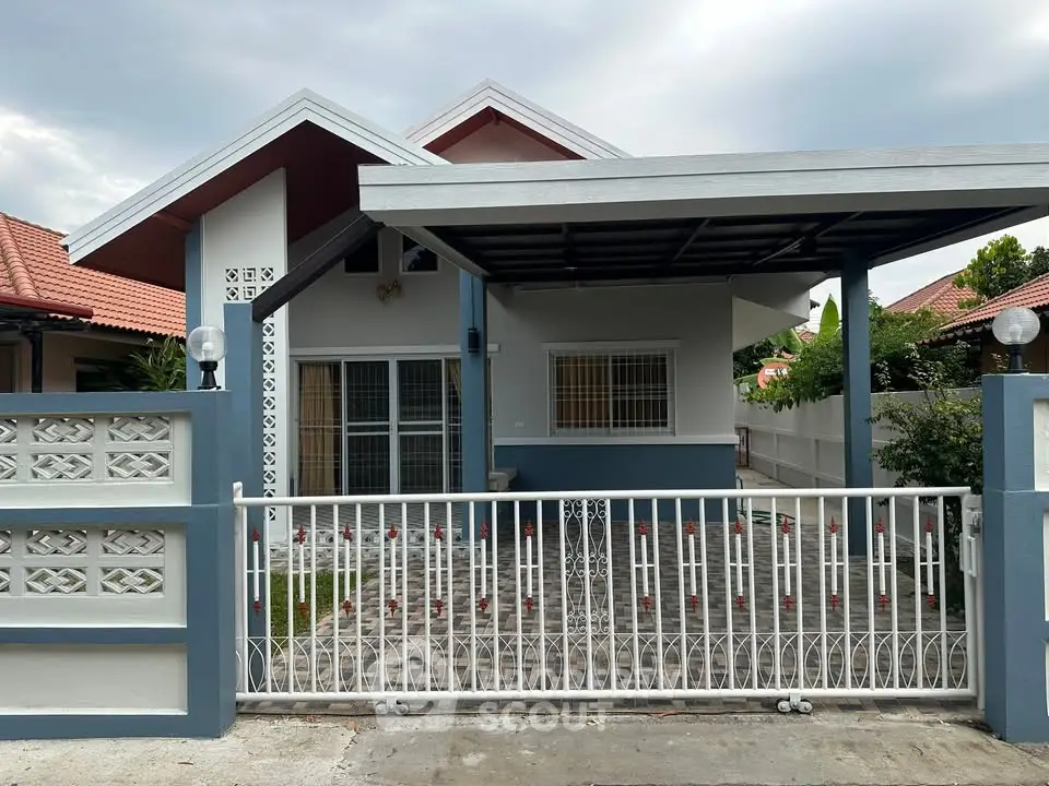 Charming single-story house with gated front yard and modern design in a peaceful neighborhood.