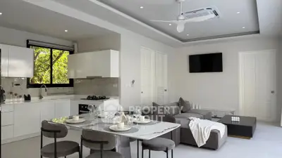 Modern open-plan kitchen and living room with sleek design and natural light.