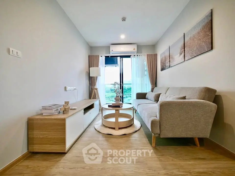 Modern living room with stylish furniture and natural light, featuring a cozy sofa and scenic view.