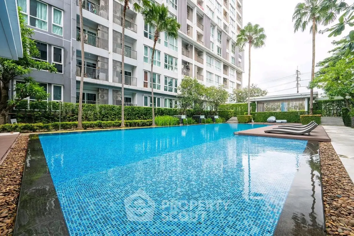 Luxurious condominium with stunning pool and lush greenery