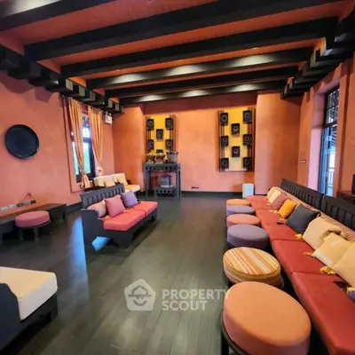 Luxurious living room with vibrant decor and cozy seating in a modern home.