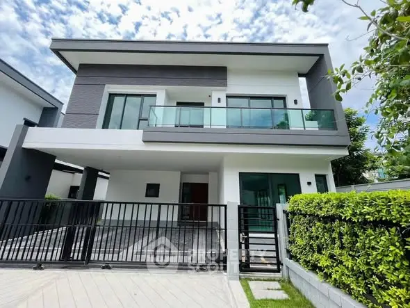 Modern two-story house with sleek design and spacious balcony