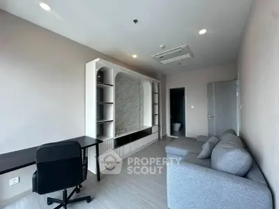 Modern living room with sleek furniture and built-in shelving, perfect for contemporary living.