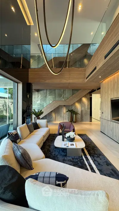 Luxurious modern living room with high ceilings and elegant decor