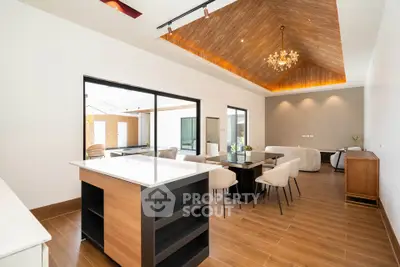 Spacious modern living room with elegant wooden ceiling and open layout