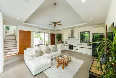 Spacious modern living room with open kitchen and elegant decor