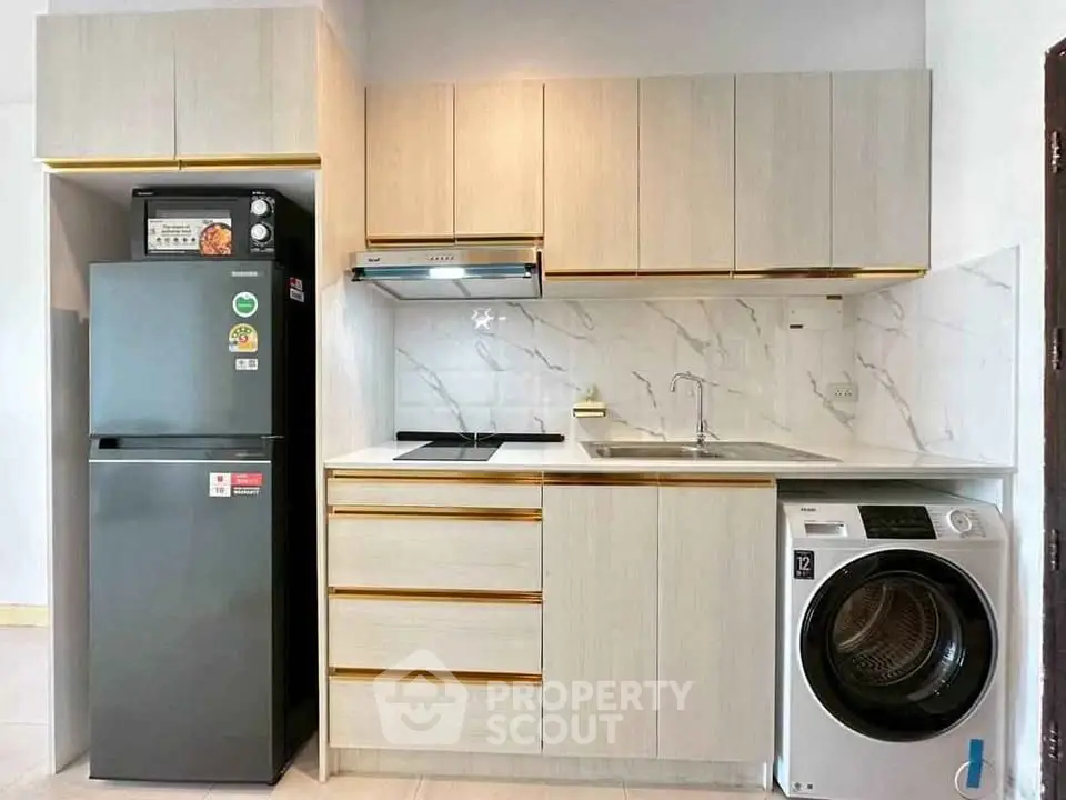 Modern kitchen with sleek appliances and stylish cabinetry