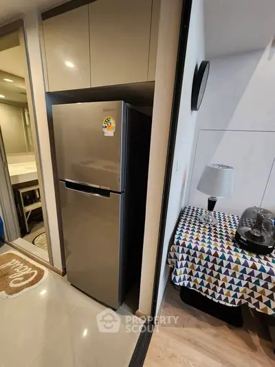 Modern apartment interior with sleek fridge and stylish decor