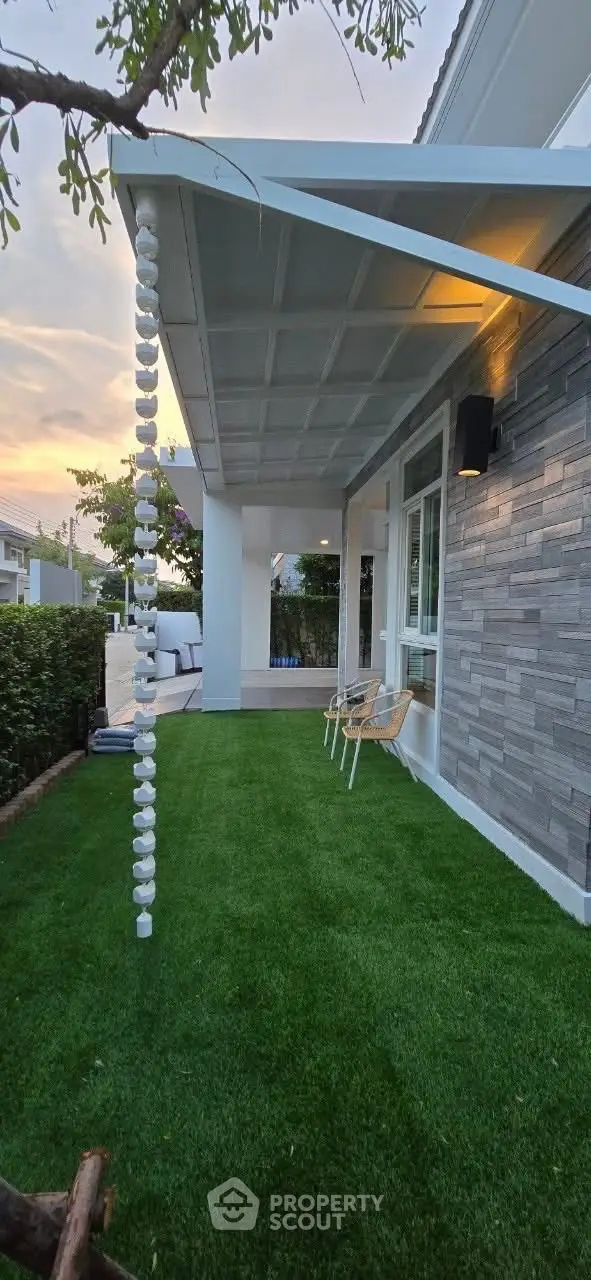 Charming garden patio with modern design and lush greenery, perfect for relaxation and outdoor gatherings.