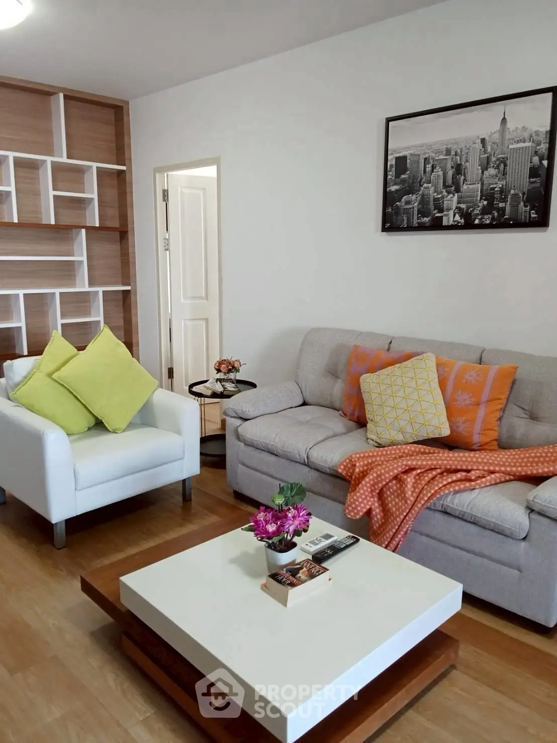 Stylish living room with modern furniture and decorative accents in a cozy apartment.