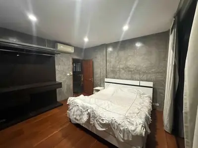 Modern bedroom with sleek design and ambient lighting