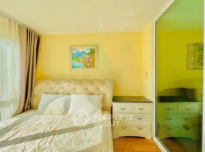 Bright and cozy bedroom with elegant decor and large window for natural light.