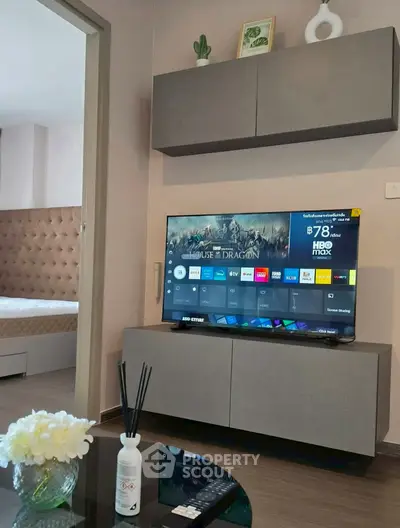 Modern living room with sleek TV setup and stylish decor, perfect for entertainment and relaxation.