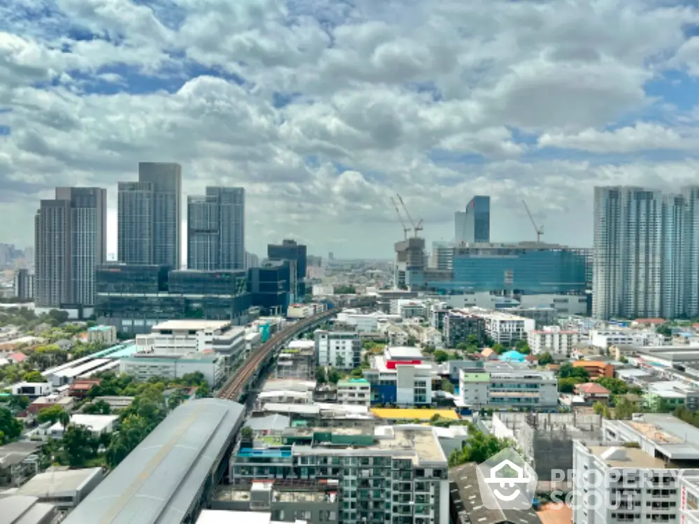 Stunning cityscape view with modern skyscrapers and urban skyline under a cloudy sky.