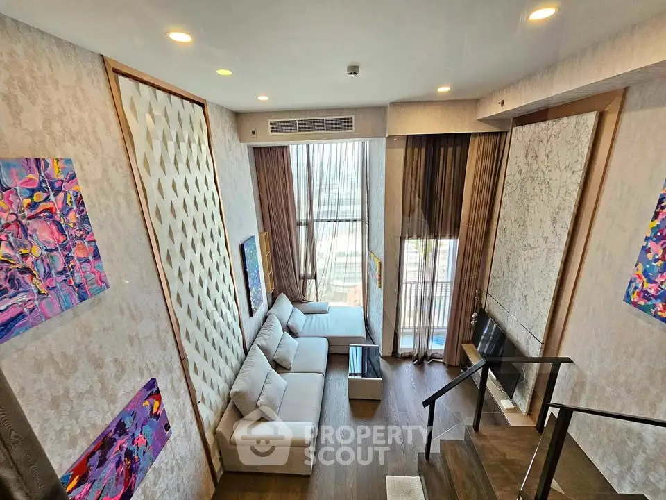 Luxurious high-ceiling living room with modern decor and large windows offering stunning city views.