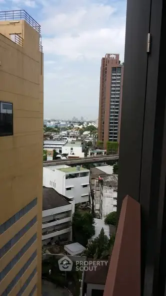 Urban cityscape view from high-rise building balcony