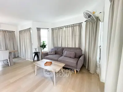 Spacious living room with modern decor and natural light