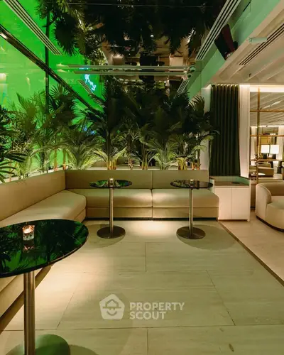 Luxurious modern lounge with elegant seating and ambient lighting, perfect for relaxation and social gatherings.