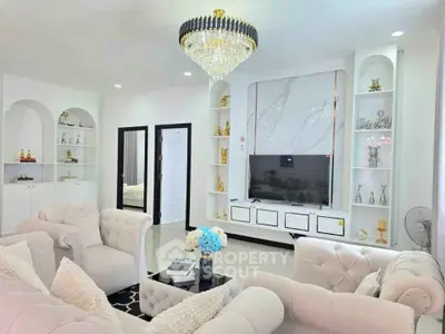 Luxurious living room with elegant chandelier and plush seating