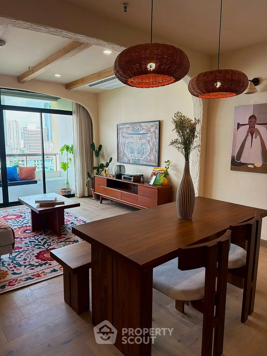 Stylish living room with wooden furniture and city view balcony in modern apartment.