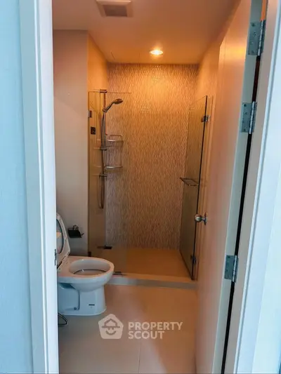 Modern bathroom with glass shower enclosure and sleek design