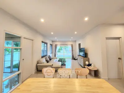 Spacious modern living room with natural light and stylish decor