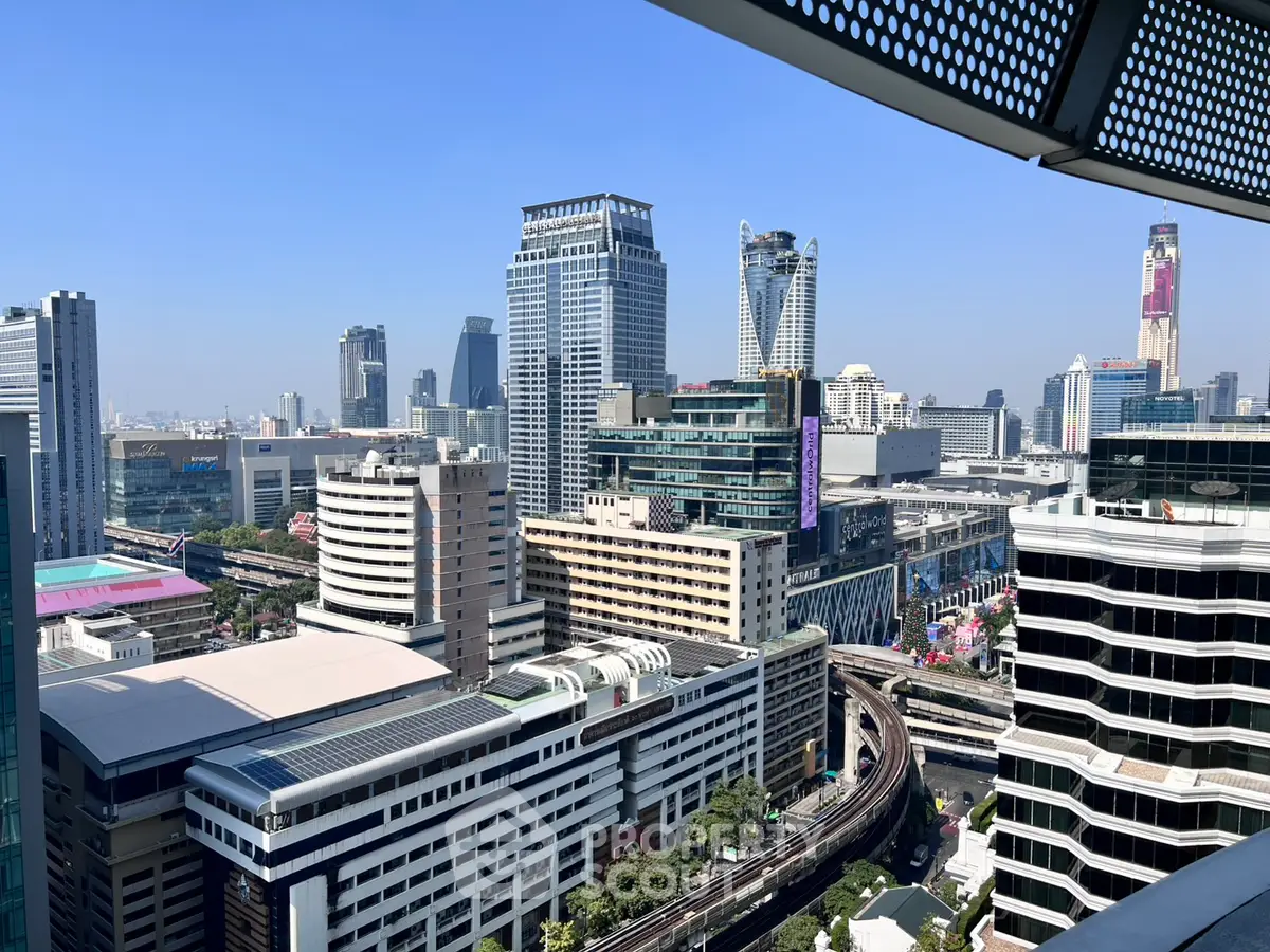 Stunning cityscape view from a high-rise balcony showcasing modern architecture and vibrant skyline.