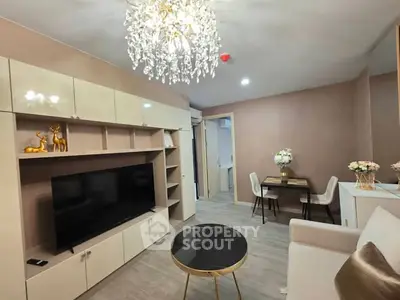 Modern living room with elegant chandelier and stylish decor