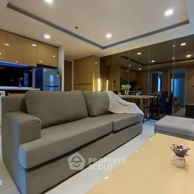 Spacious modern living room with elegant gray sofa and stylish decor