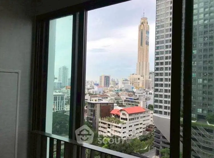 Stunning cityscape view from high-rise apartment window in urban setting.